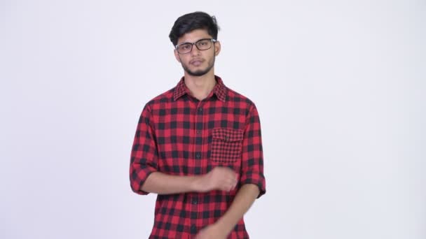 Young handsome bearded Indian hipster man with arms crossed — Stock Video