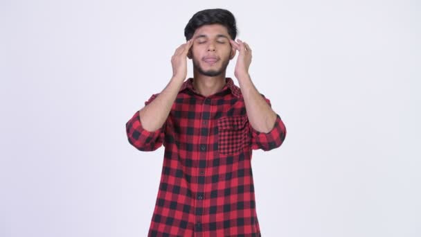 Young stressed bearded Indian hipster man having headache — Stock Video