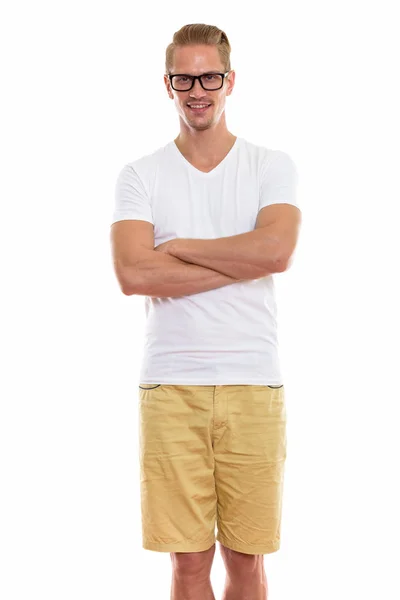 Young happy man smiling and standing while wearing eyeglasses wi — Stock Photo, Image