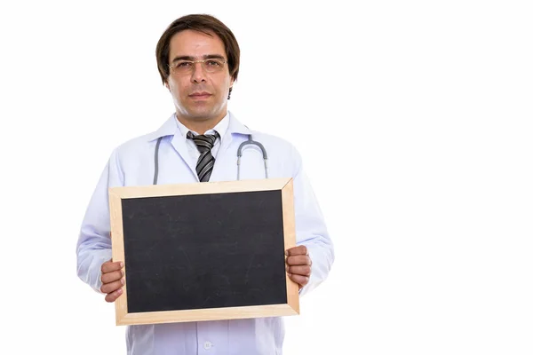 Estúdio tiro de jovem persa homem médico segurando quadro branco — Fotografia de Stock