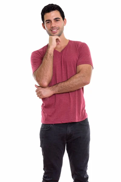 Studio shot of young happy Hispanic man smiling while thinking — Stock Photo, Image