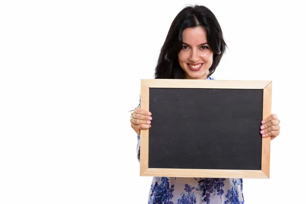 Studio shot of young happy Spanish businesswoman smiling while h — Stock Photo, Image