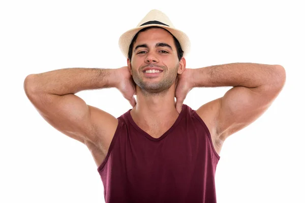 Studio shot of young happy Hispanic man smiling with both arms b — Stock Photo, Image
