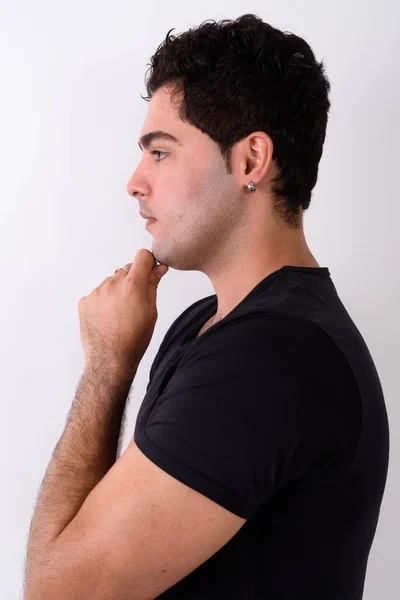 Young handsome Persian man against white background — Stock Photo, Image