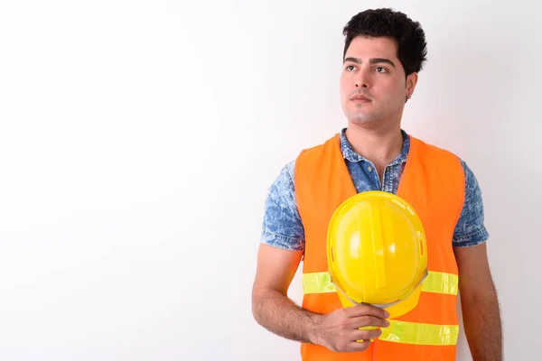 Jovem bonito persa homem construção trabalhador contra branco bac — Fotografia de Stock