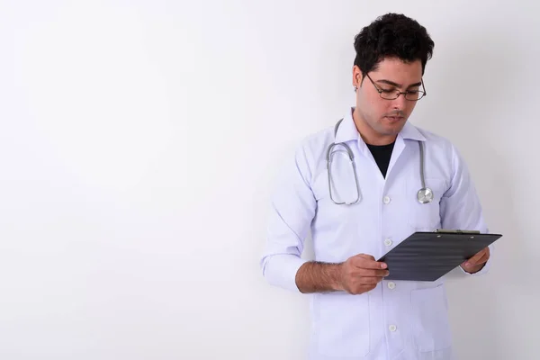 Young handsome Persian man doctor wearing eyeglasses against whi — Stock Photo, Image