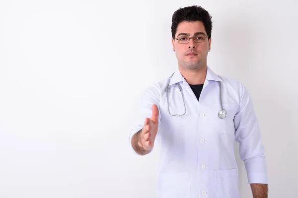 Young handsome Persian man doctor wearing eyeglasses against whi — Stock Photo, Image