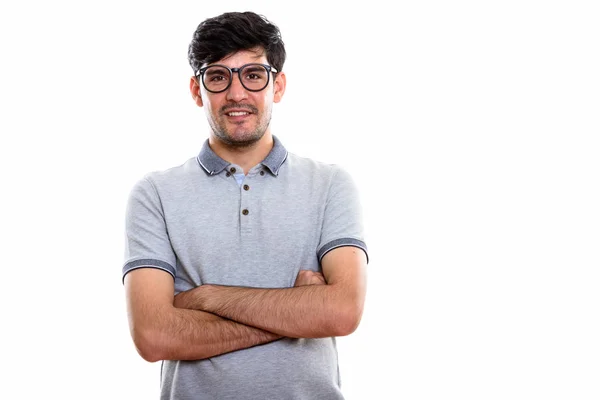 Studio shot van jonge gelukkig Perzisch man die lacht terwijl het dragen van oog — Stockfoto