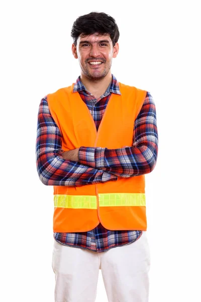 Studio shot of young happy Persian man construction worker smili — Stock Photo, Image