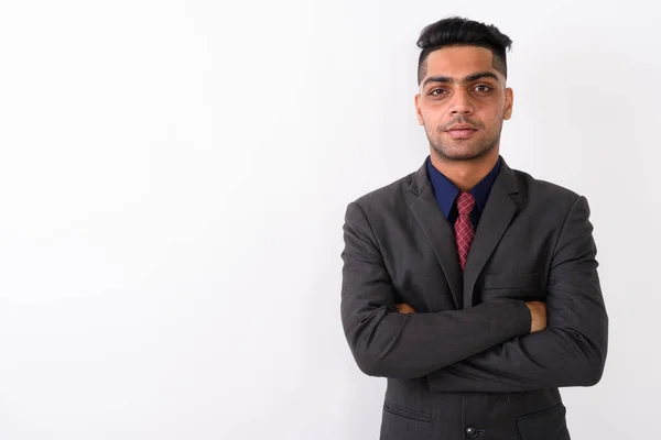 Junger indischer Geschäftsmann trägt Anzug vor weißem Hintergrund — Stockfoto