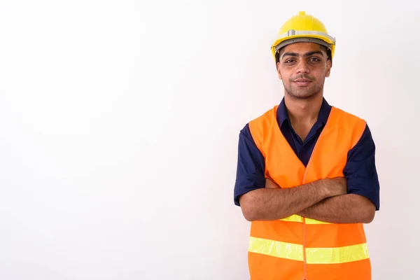 Indiase jongeman bouwvakker tegen witte achtergrond — Stockfoto