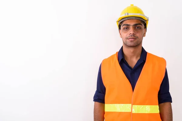 Indiase jongeman bouwvakker tegen witte achtergrond — Stockfoto