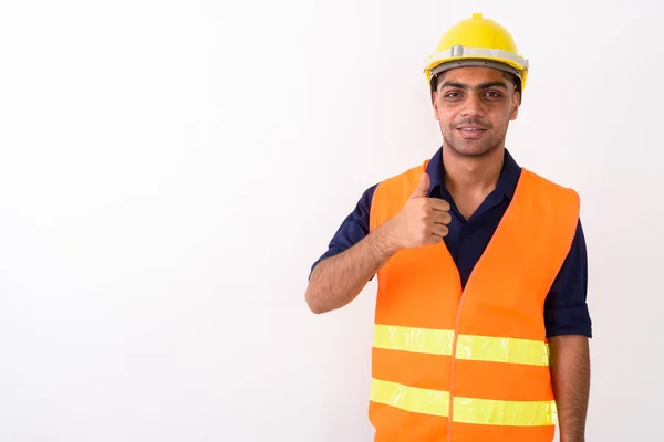 Joven trabajador de la construcción indio contra fondo blanco — Foto de Stock