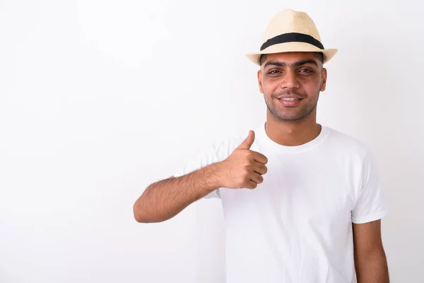 Young Indian tourist man wearing hat against white background — Stock Photo, Image