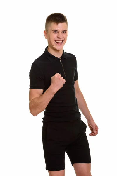 Joven feliz caucásico hombre sonriendo y buscando motivado — Foto de Stock