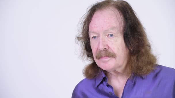 Happy senior man with mustache wearing purple silky shirt — Stock Video