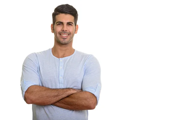 Guapo hombre persa feliz sonriendo con los brazos cruzados —  Fotos de Stock