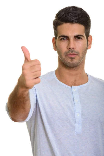 Joven hombre persa guapo dando el pulgar hacia arriba — Foto de Stock