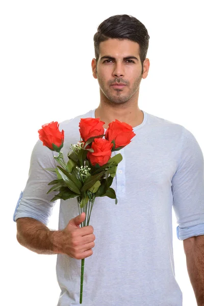 Jovem bonito persa homem segurando rosas vermelhas pronto para Valentine — Fotografia de Stock