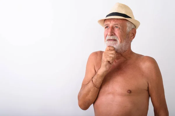 Handsome senior bearded man thinking and having hand on chin — Stock Photo, Image