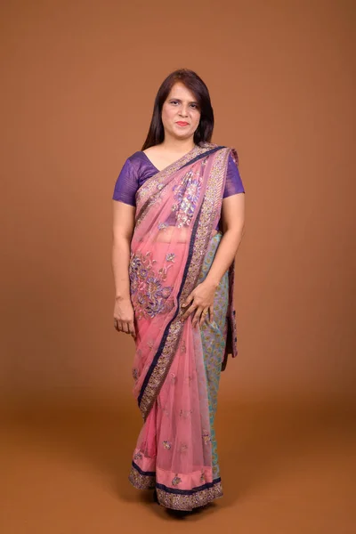 Mature Indian woman wearing Sari Indian traditional clothes