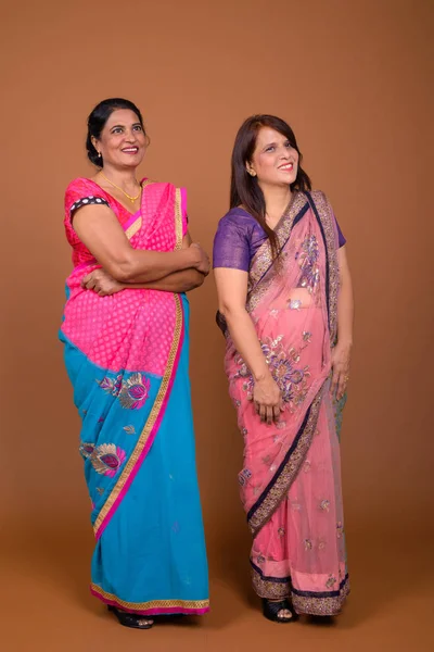 Two mature Indian women wearing Sari Indian traditional clothes