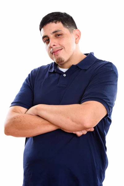Studio shot of young Hispanic man with arms crossed — Stock Photo, Image