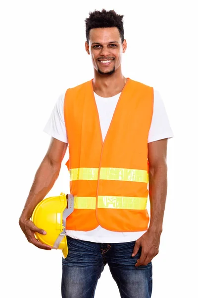 Young happy African man construction worker smiling while holdin — Stock Photo, Image