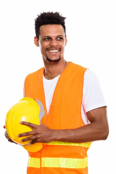 Pensativo feliz Africano homem trabalhador da construção sorrindo enquanto h — Fotografia de Stock