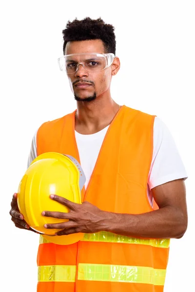 Young African man construction worker holding safety helmet with — Stock Photo, Image