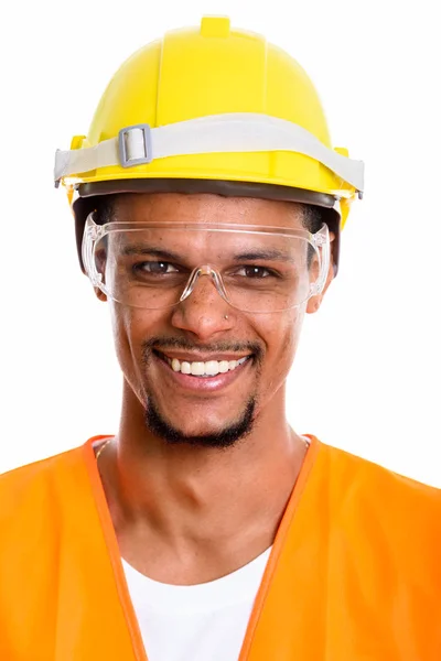 Gezicht van gelukkig Afrikaanse man bouwvakker glimlachen terwijl slijtage — Stockfoto