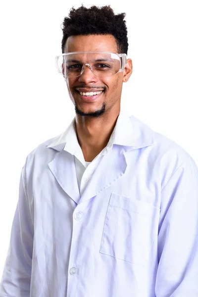 Studio shot of young happy African man doctor smiling while wear — Stock Photo, Image