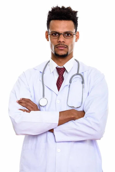 Studio shot of young African man doctor wearing eyeglasses with — Stock Photo, Image