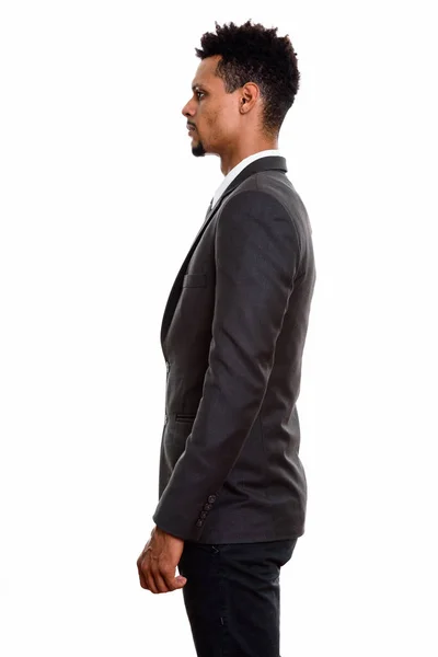 Profile view of young African businessman standing — Stock Photo, Image