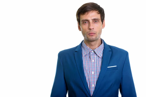 Studio shot of young handsome businessman looking at camera — Stock Photo, Image