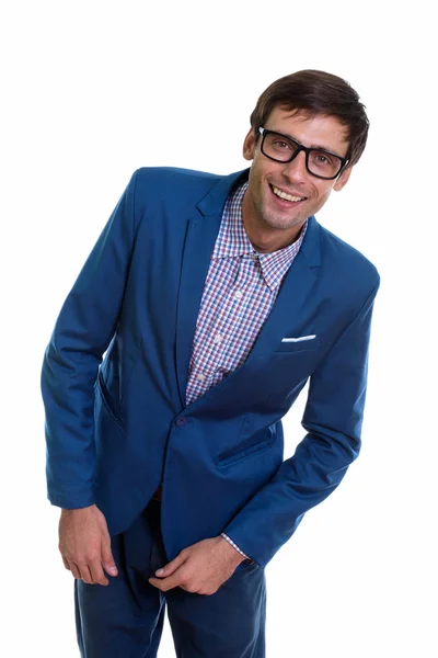 Studio shot of young happy businessman smiling and leaning to th — Stock Photo, Image