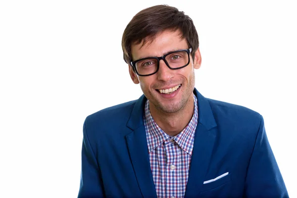 Studio shot of young happy businessman  smiling while wearing ey — Stock Photo, Image