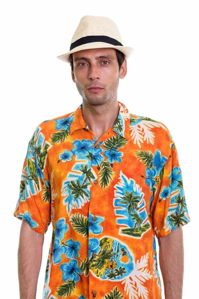 Studio shot of young handsome tourist man ready for vacation — Stock Photo, Image