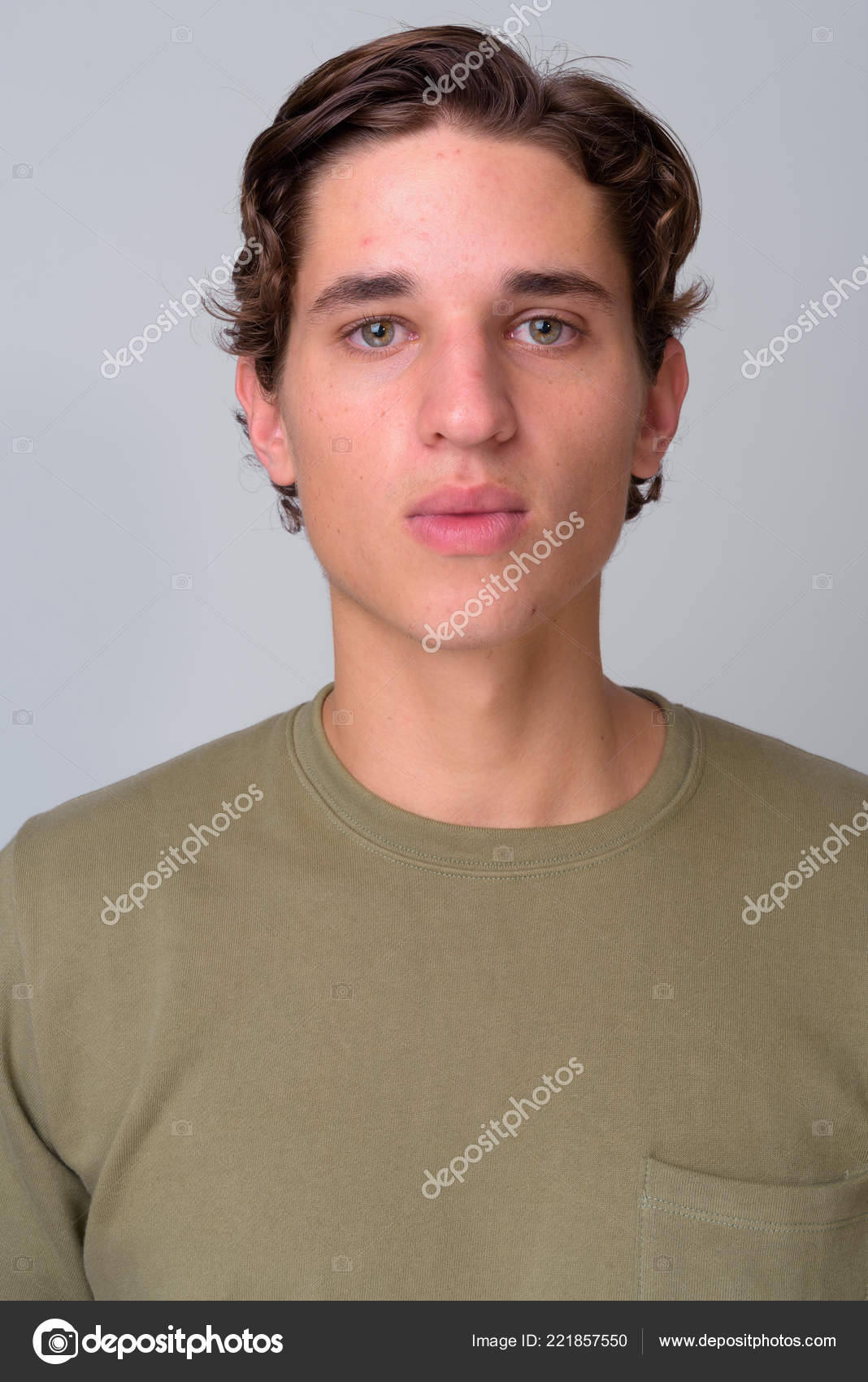 Young Handsome Man With Wavy Hair Against White Background Stock