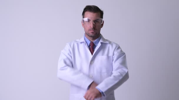 Studio Shot Young Handsome Hispanic Man Doctor Wearing Protective Glasses — Stock Video