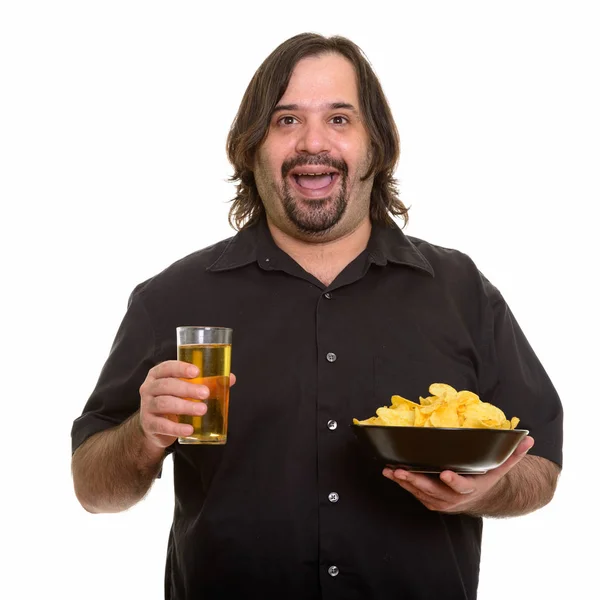 Happy fat bearded Caucasian man smiling while holding bowl of ch — Stock Photo, Image