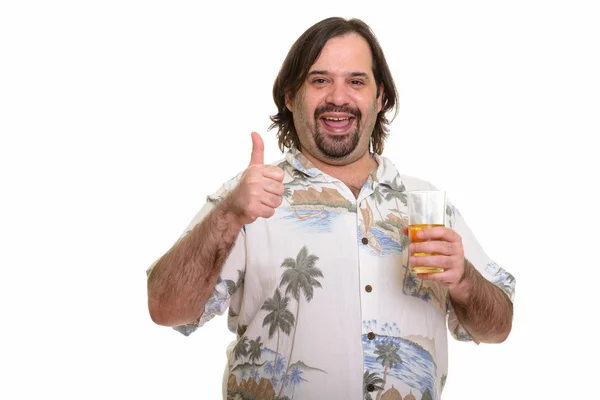 Happy fat Caucasian man smiling while giving thumb up and holdin — Stock Photo, Image