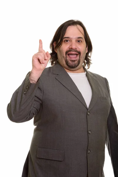 Feliz gordo caucásico hombre de negocios sonriendo y señalando el dedo hacia arriba —  Fotos de Stock
