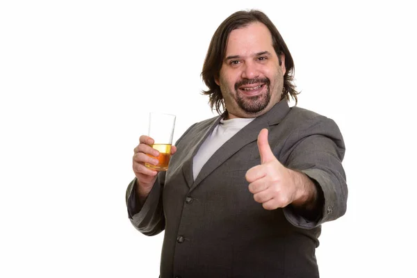 Happy fat Caucasian businessman smiling and holding glass of bea — Stock Photo, Image