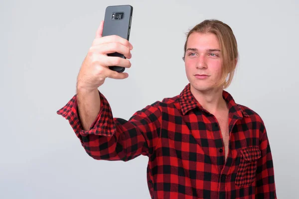 Young handsome hipster man with long blond hair — Stock Photo, Image