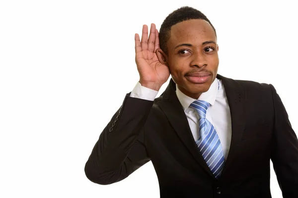 Joven hombre de negocios africano guapo escuchando y ventosa oreja —  Fotos de Stock