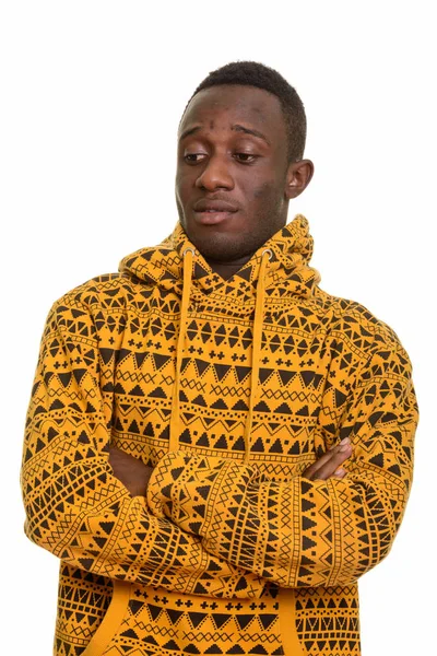 Young handsome African man with arms crossed looking down — Stock Photo, Image