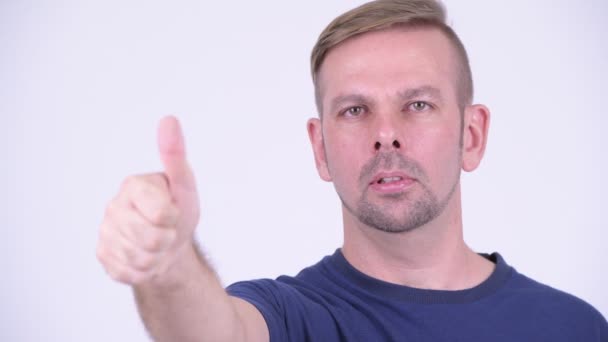 Portrait of happy blonde man giving thumbs up — Stock Video