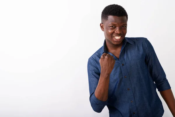 Studio shot of young happy black African man smiling while looki — Stock Photo, Image