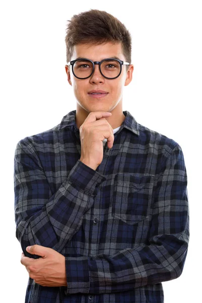 Studio shot of young handsome man thinking — Stock Photo, Image